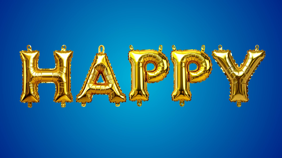 Festive 3D text from gold foil balloons: inflated letters